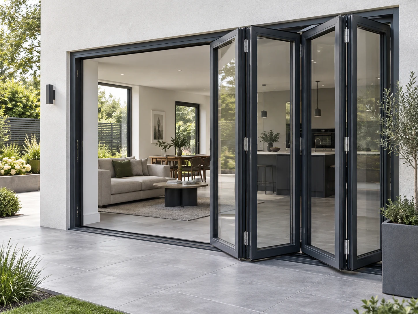 Aluminium folding doors opening a living area to the garden